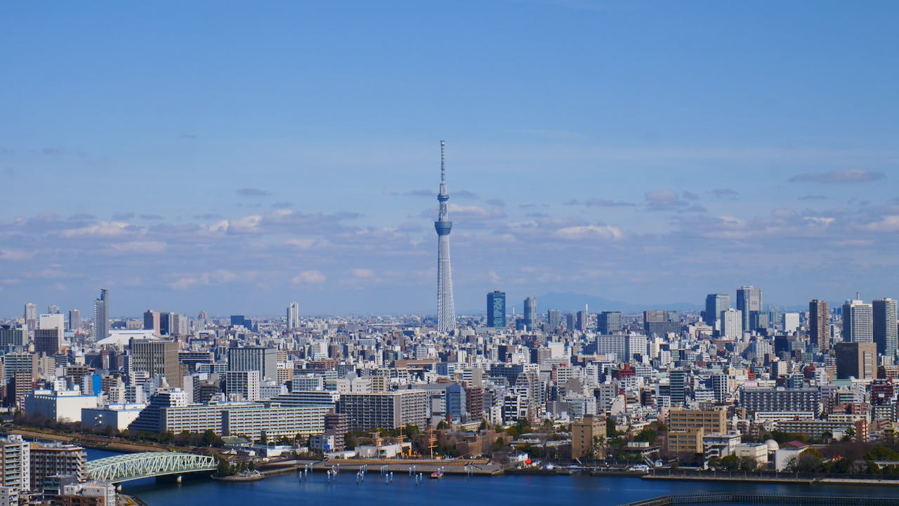 Services-03 Aerial view of Tokyo skyline, featuring the iconic Tokyo Skytree under a clear blue sky.